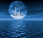 full moon over water with gemini symbol
